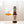 A bottle of On The Wagon Hojicha Kombucha with a glass filled with kombucha