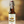 Bottle of 'On the Wagon' Malt Hops Kombucha on a wooden surface with a blurred background